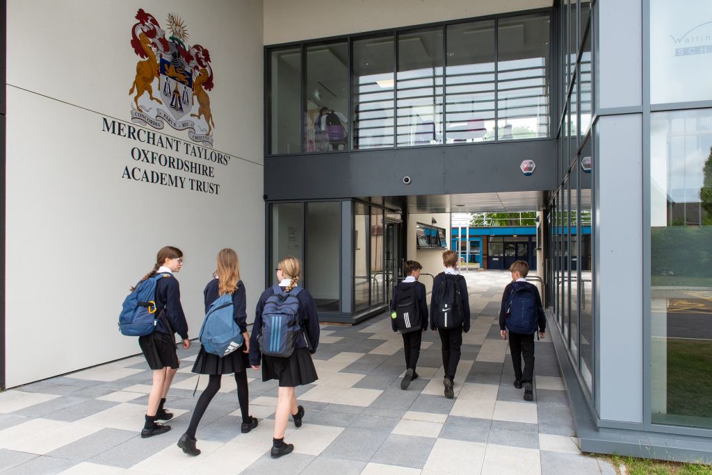 students walking through the new building