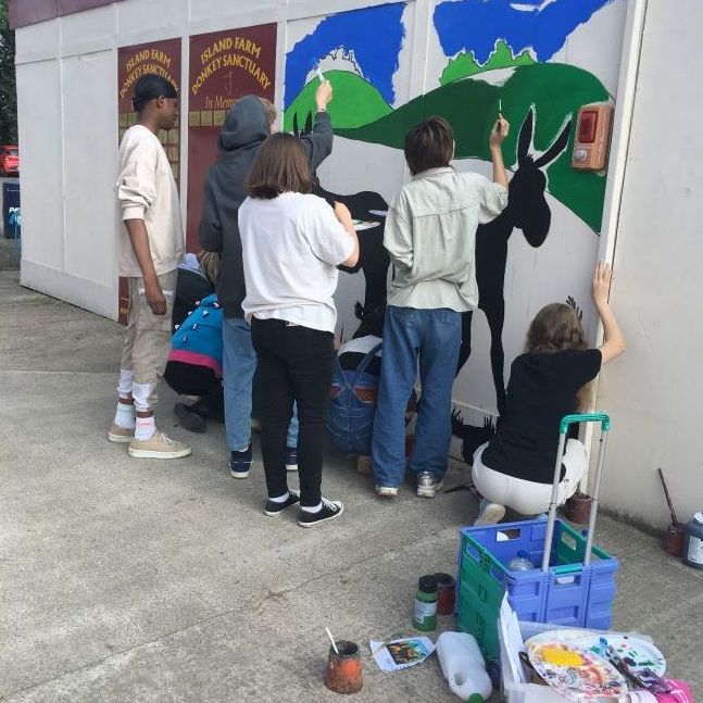 Students painting the mural.