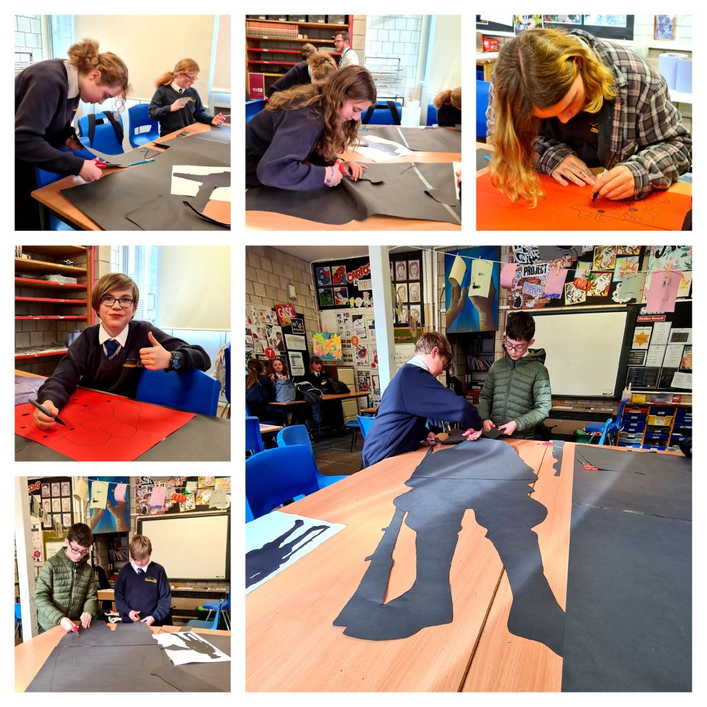 Students create the poppies and soldier silhouettes