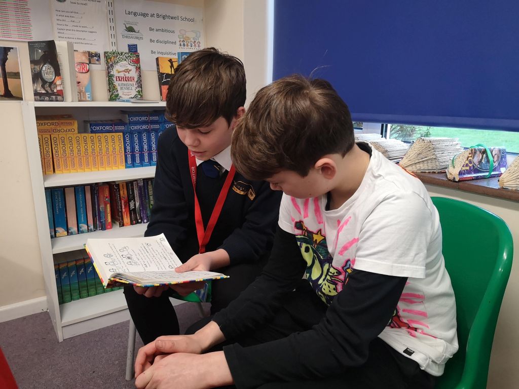 Boys reading together