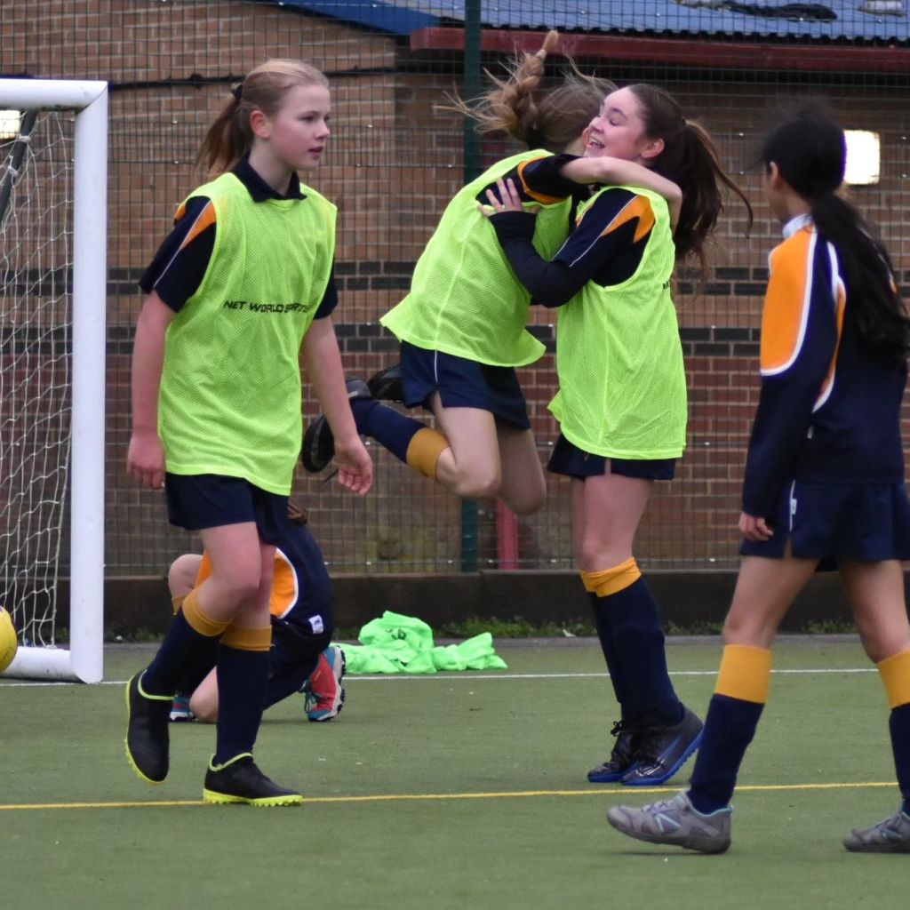 Students celebrating during a football match