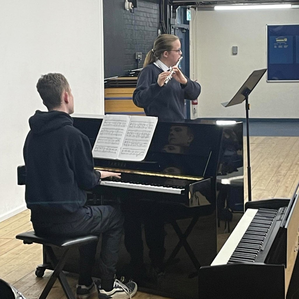 Students playing in the summer recital