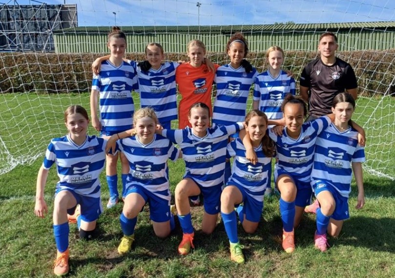 Isabel with her football teammates