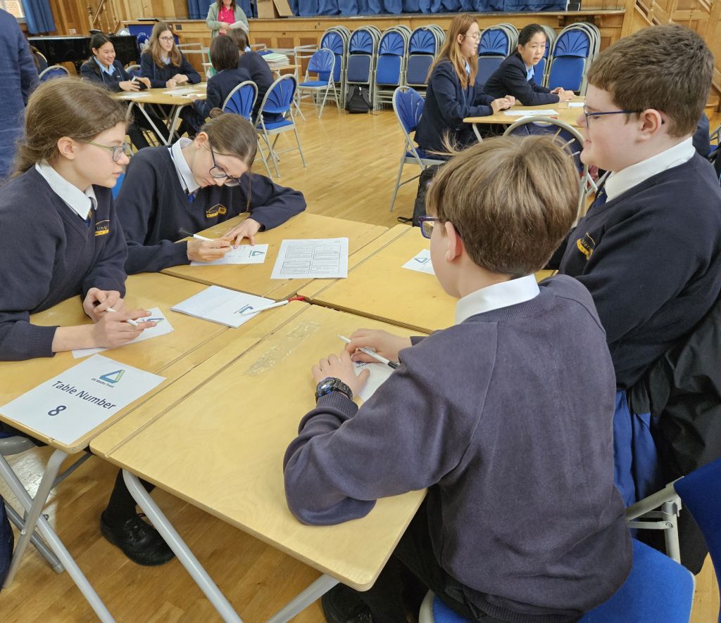 Students working on maths challenge puzzles