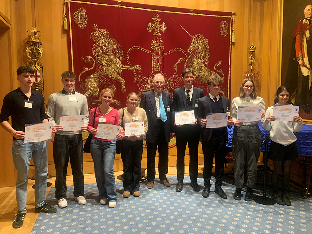 Students holding certificates at Livery Entrepreneurs Challenge