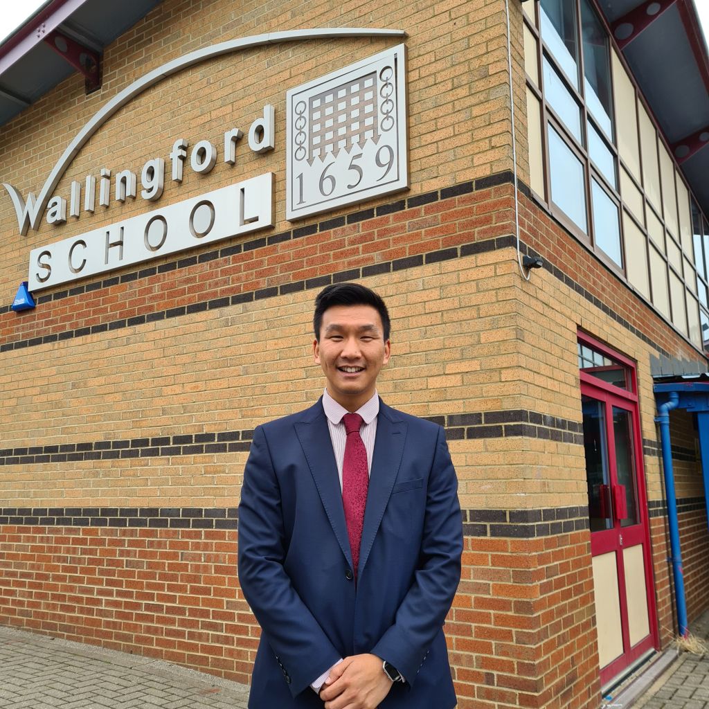 Mr Choi in front of the school