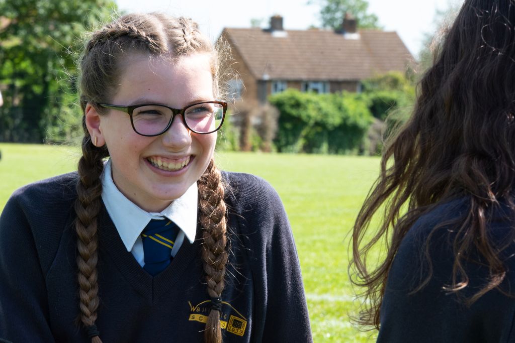 Girl smiling on the school field