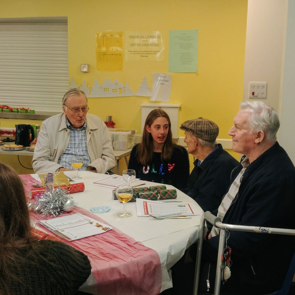 A sixth former chats with our Christmas visitors.
