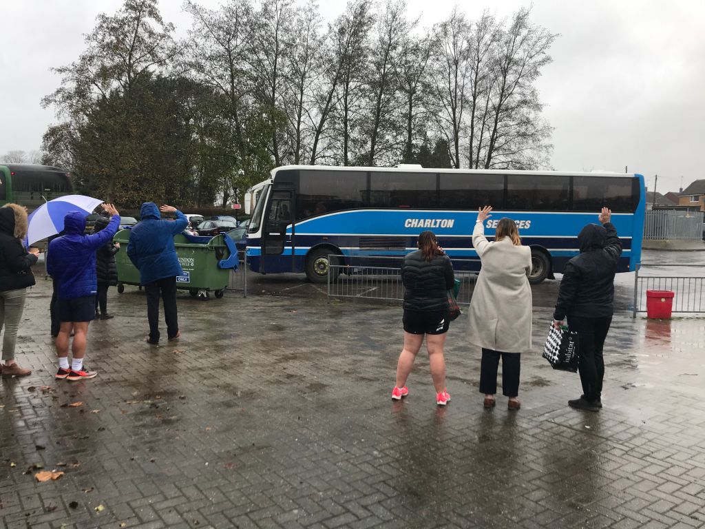 Braver staff stand out waving in the rain