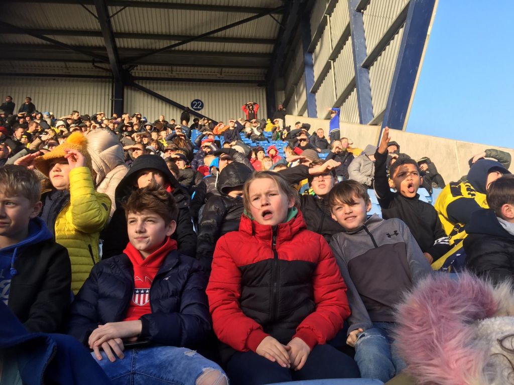 Students watching the match