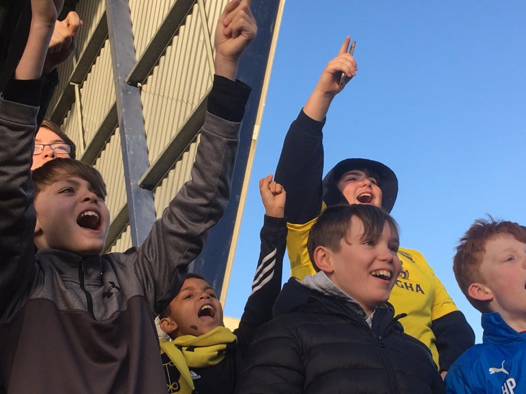 Students cheering on the players