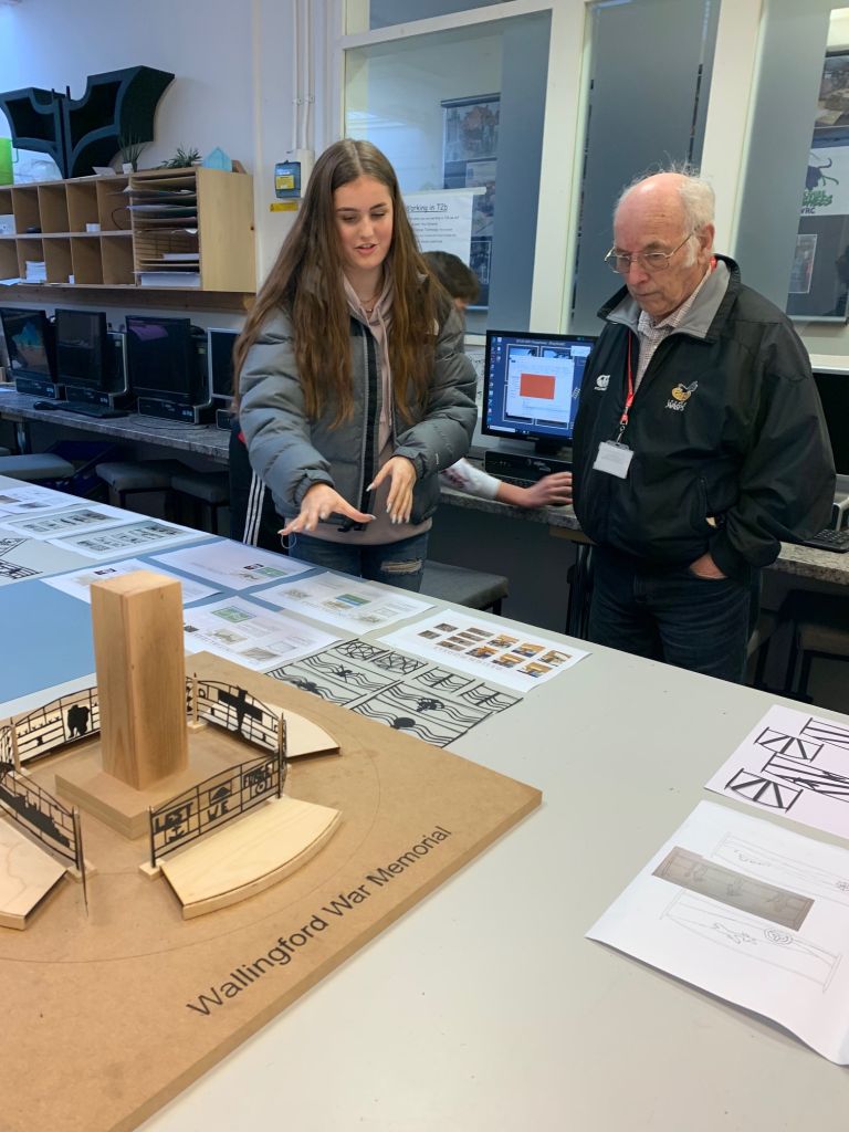 A student explains her design ideas.