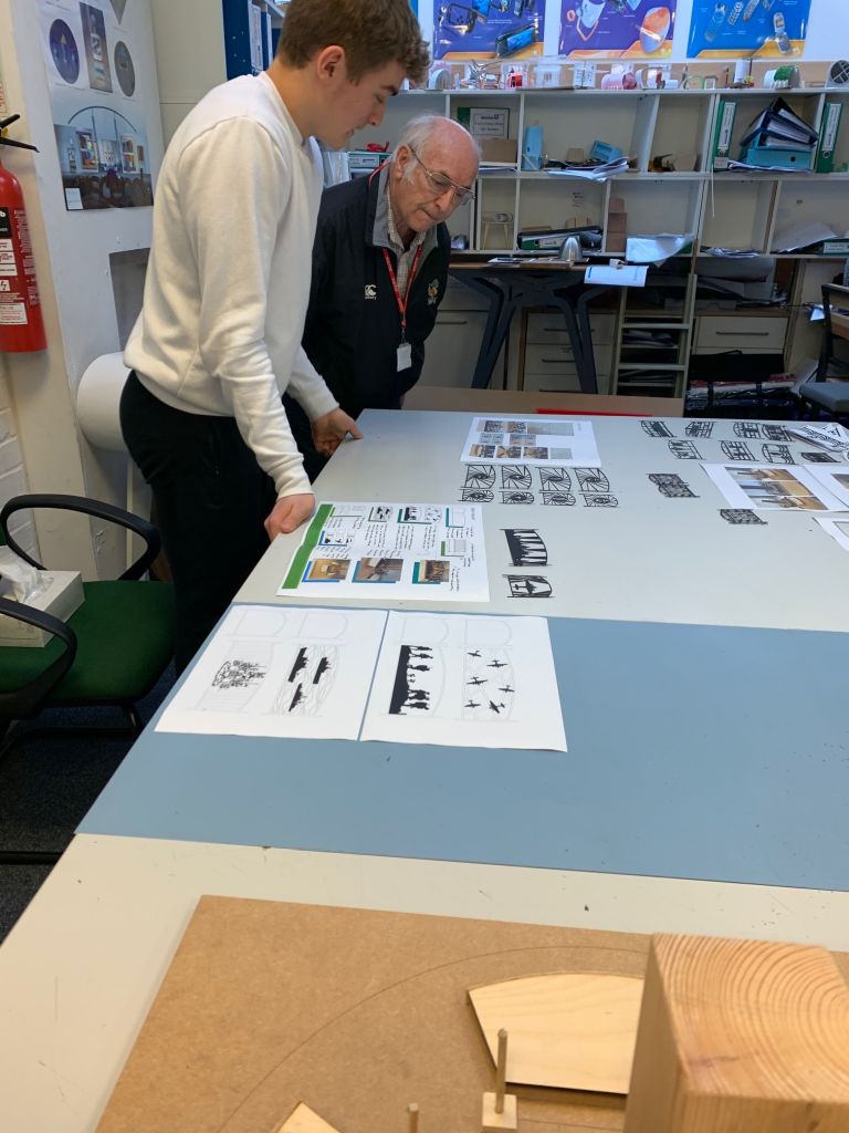 Student directs Mr Kidley through some design ideas.