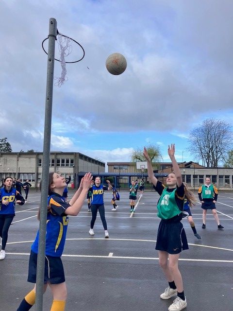 Girls playing netball - the net looks a bit sad though