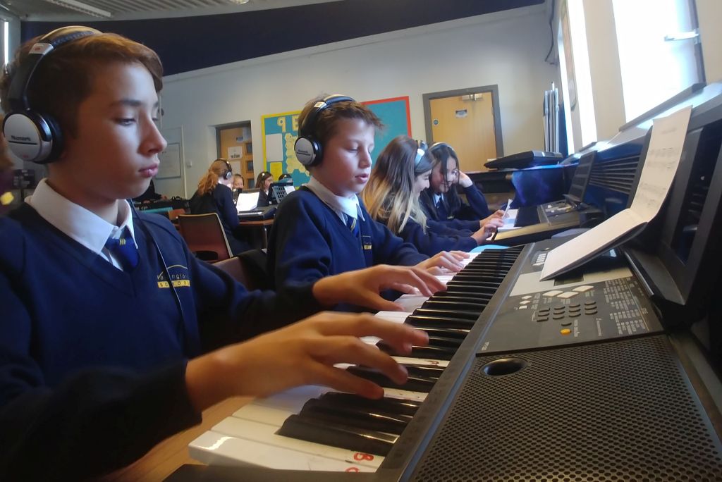 Students playing keyboards