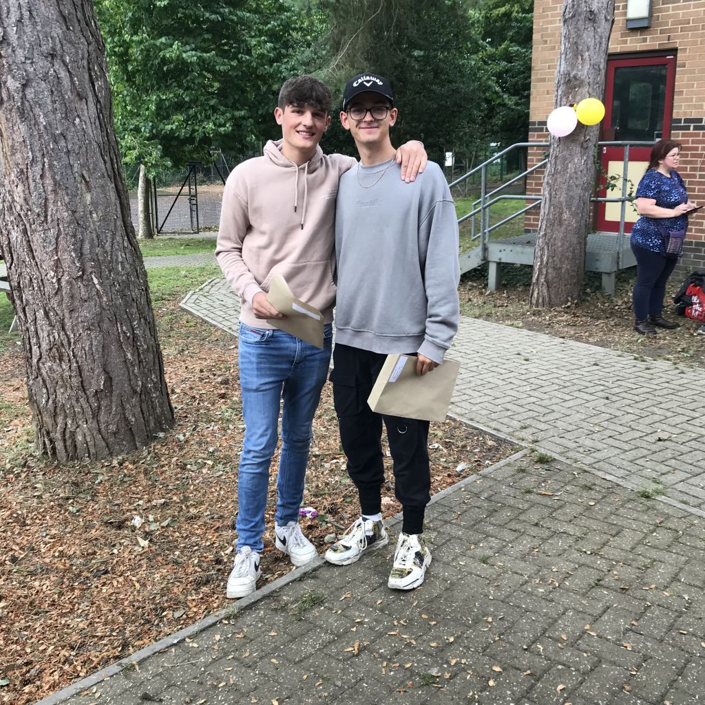 Two students with their results
