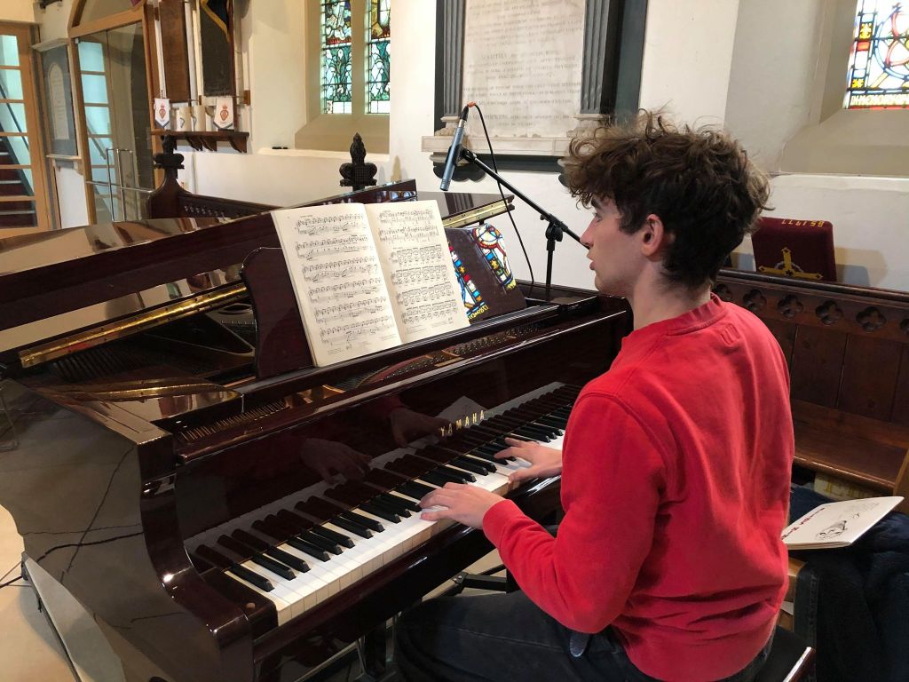 Student playing the piano