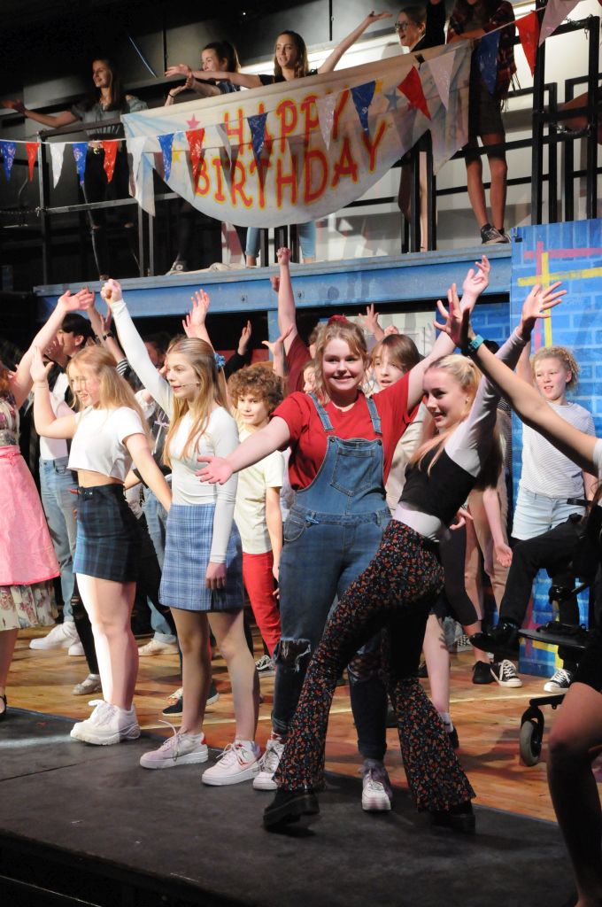 Students performing Our House