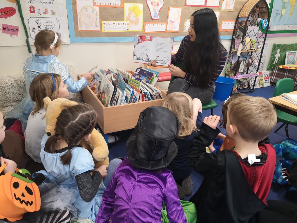 Girl reading to Brightwell students