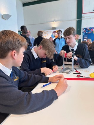Students creating a model wind turbine